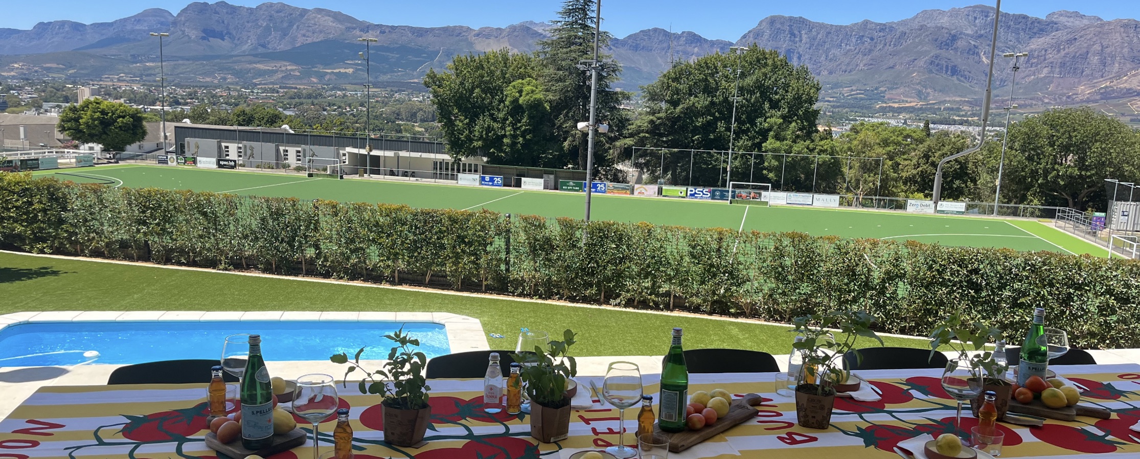 View across the Paarl Girls' High School sports fields toward the Paarl mountains